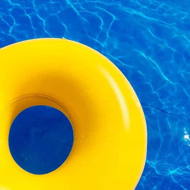 yellow floatie in a fiberglass swimming pool