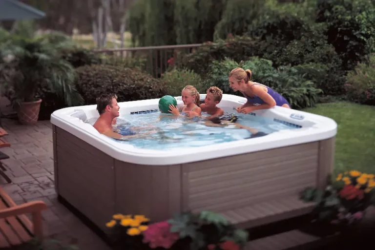 family in hot tub with ball