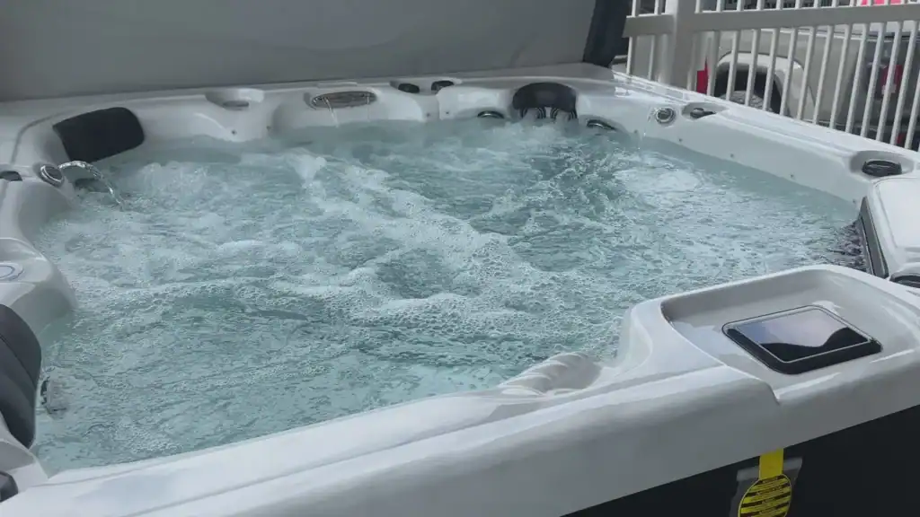 What does heat therapy in a hot tub do