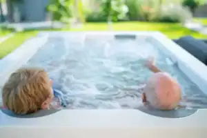 Couple relaxing in an outdoor hot tub as part of a healthy lifestyle