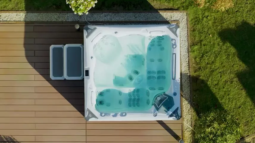 Overhead view of a dual lounger hot tub showing two full recline lounge seats and jet layout