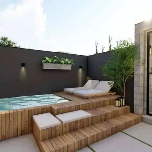 Half above ground hot tub placement on a raised deck platform with steps