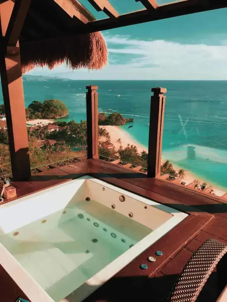 Hot tub on the covered deck of a vacation rental property overlooking the ocean