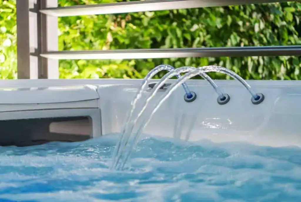 water jets filling a hot tub with gallons of fresh water