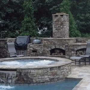 In-ground hot tub built into a custom backyard patio