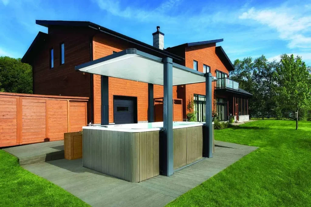Swim spa with a cover installed in a backyard space
