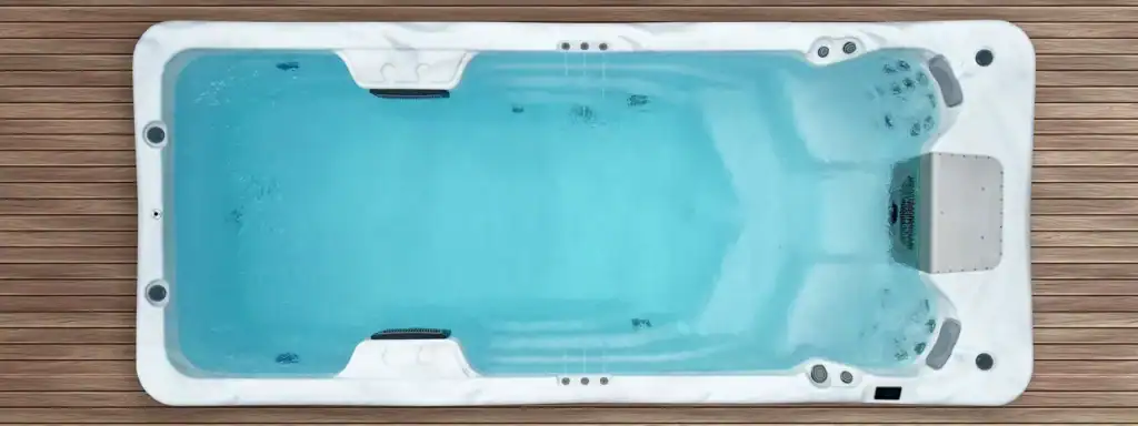 Overhead view of a swim spa for seniors with an open swim lane and hydrotherapy seats